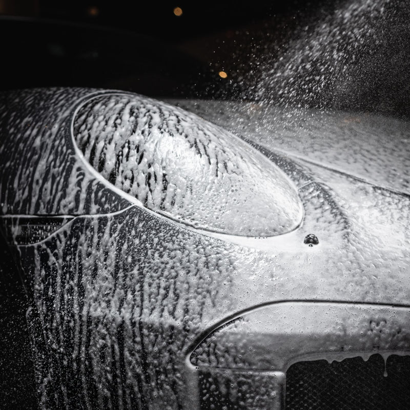 Car covered in shampoo foam during a ProTech Car Wash at Home